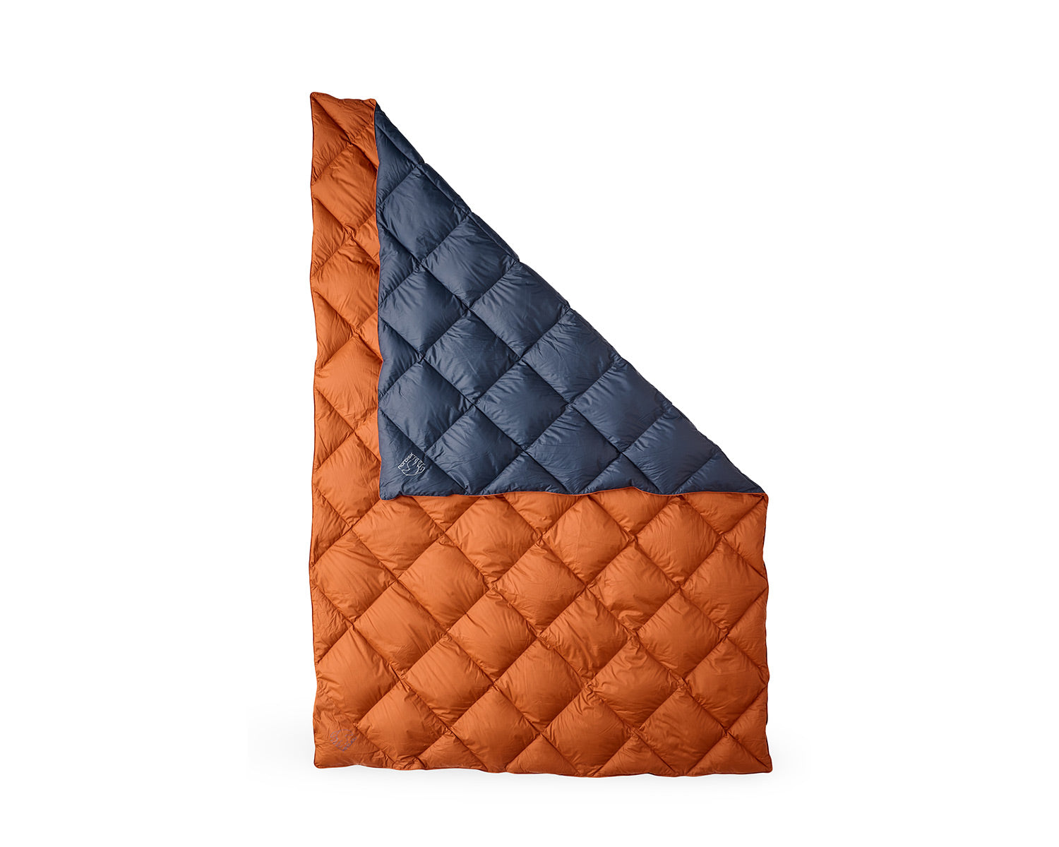 Quilted blanket with orange and blue diamond pattern on a white background
