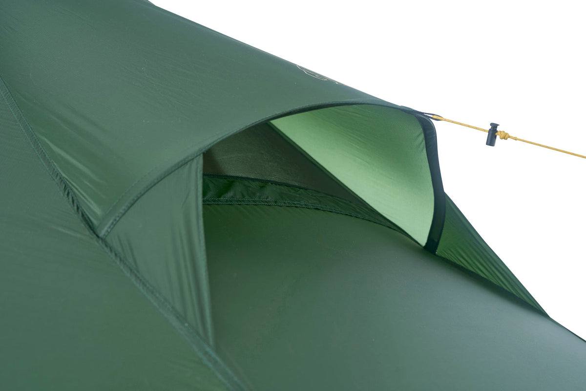 Green camping tent with a close-up of the entrance on a white background