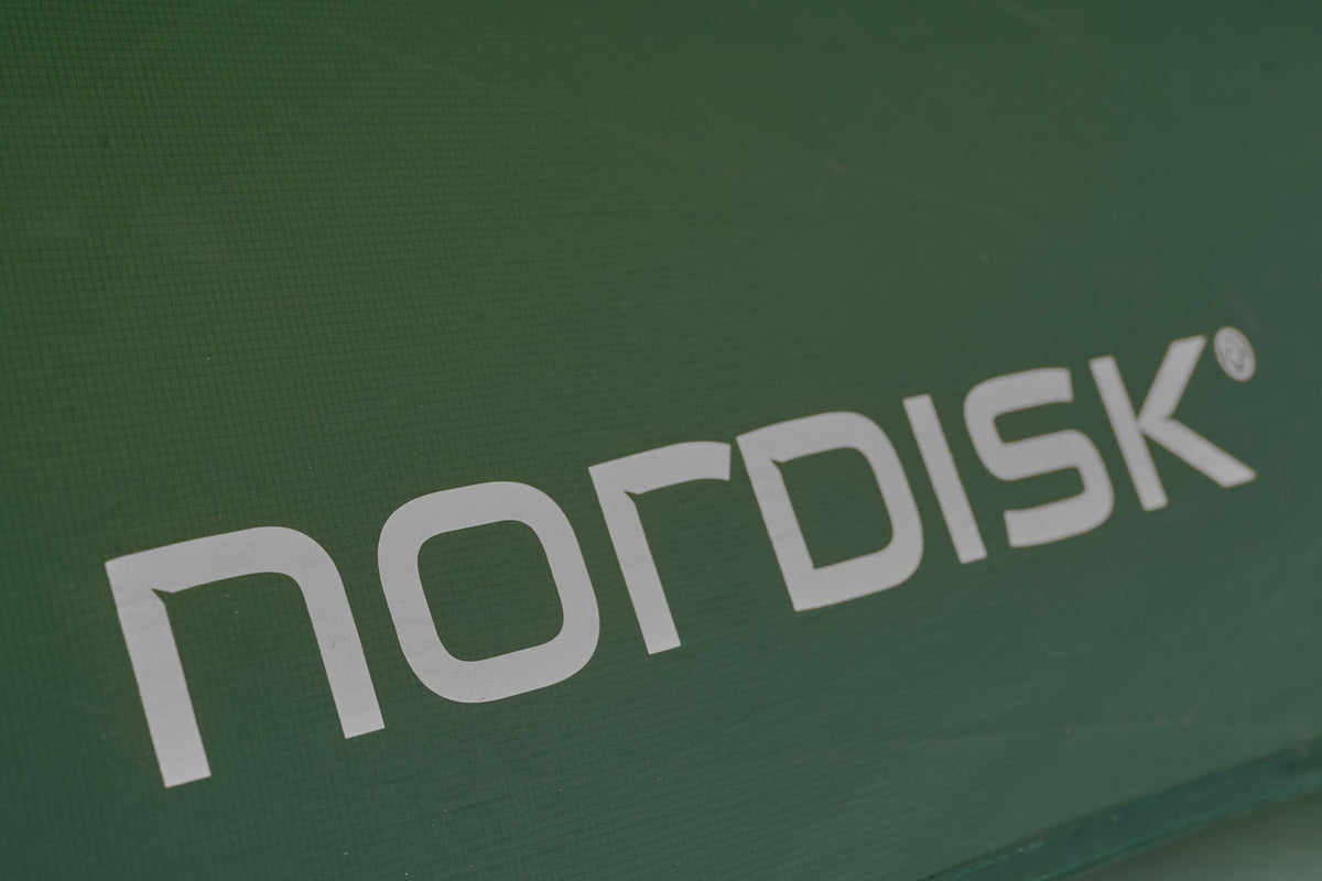 Nordisk logo on a green background