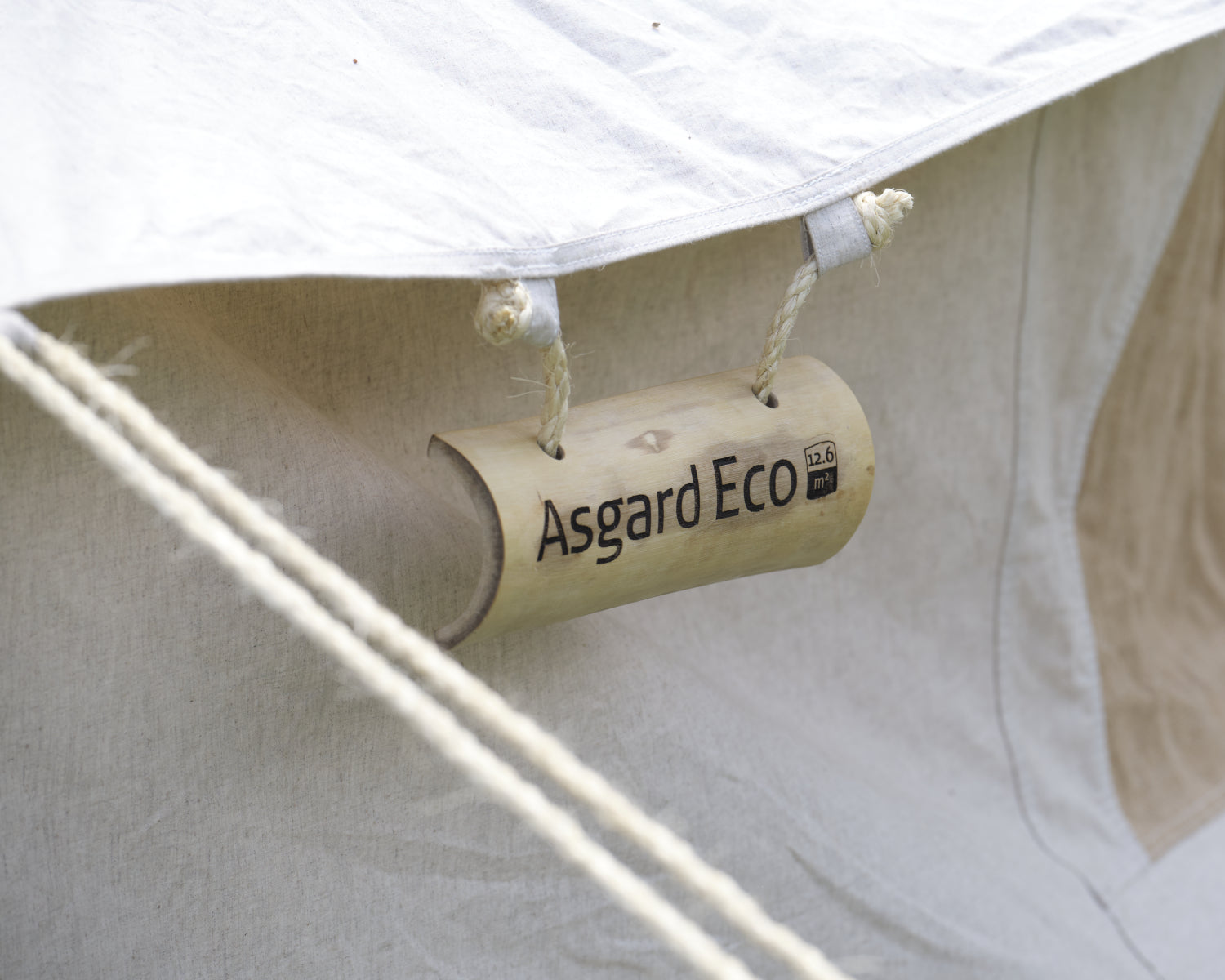 Close-up of a tent with 'Asgard Eco' branding on a white background