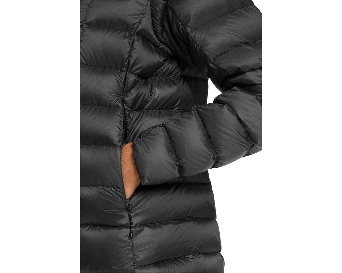 Close-up of a black puffer jacket with a white background