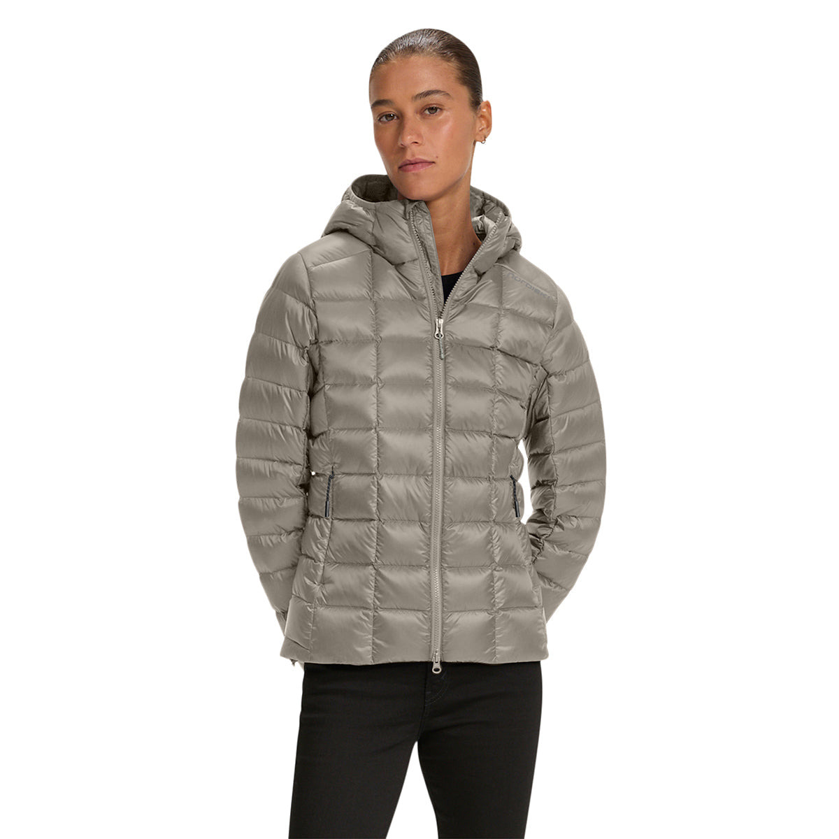 A woman wearing a light gray hooded puffer jacket with a full front zipper, shown against a plain white background.
