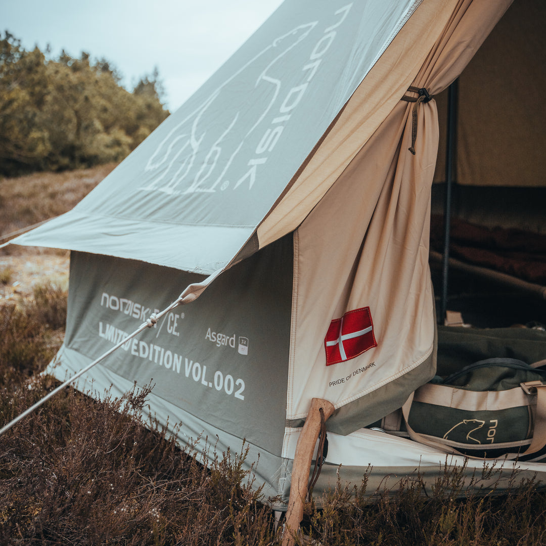 Tent with visible branding in a natural setting