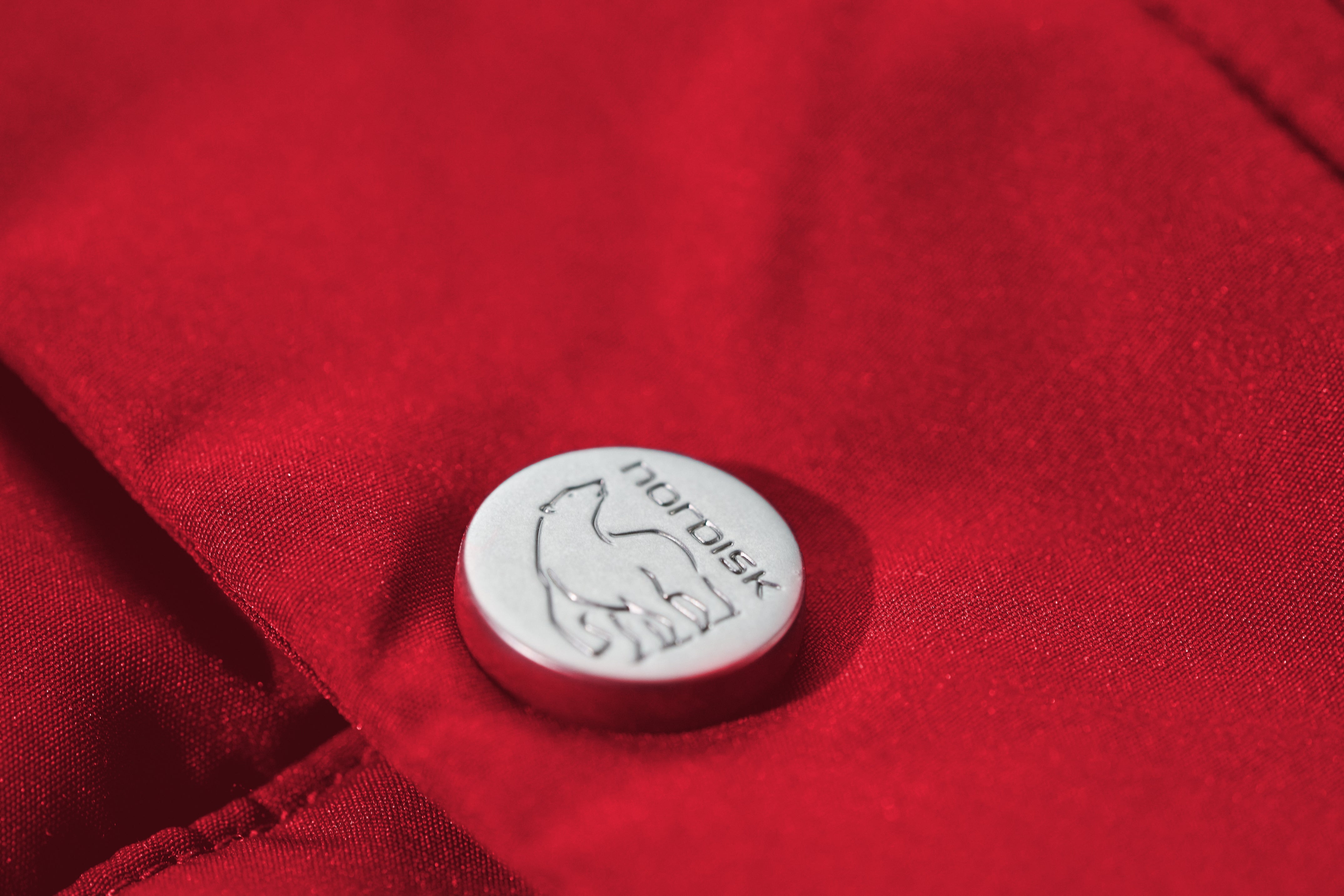 125 Jahre Caravan Unisex Daunenweste - Samba Red
